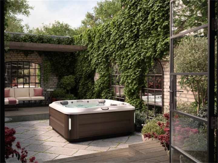 Private backyard hot tub set amid ivy-covered brick walls, secluded garden spa nook